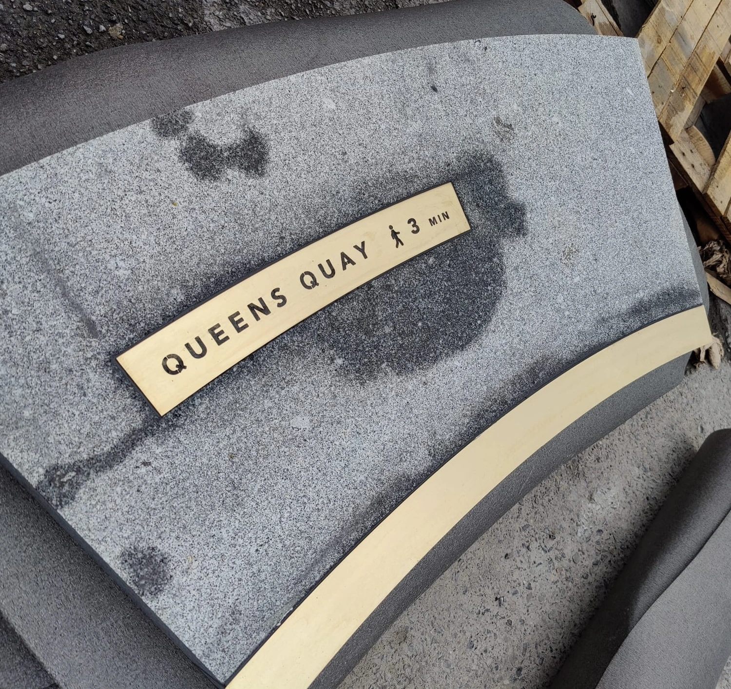 Granite paving with brass