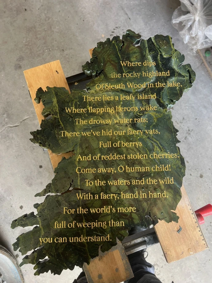 Engraved letters on stone cut out of ireland