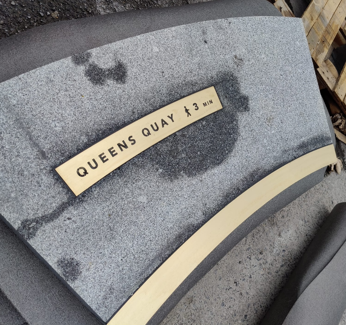 Granite paving with brass